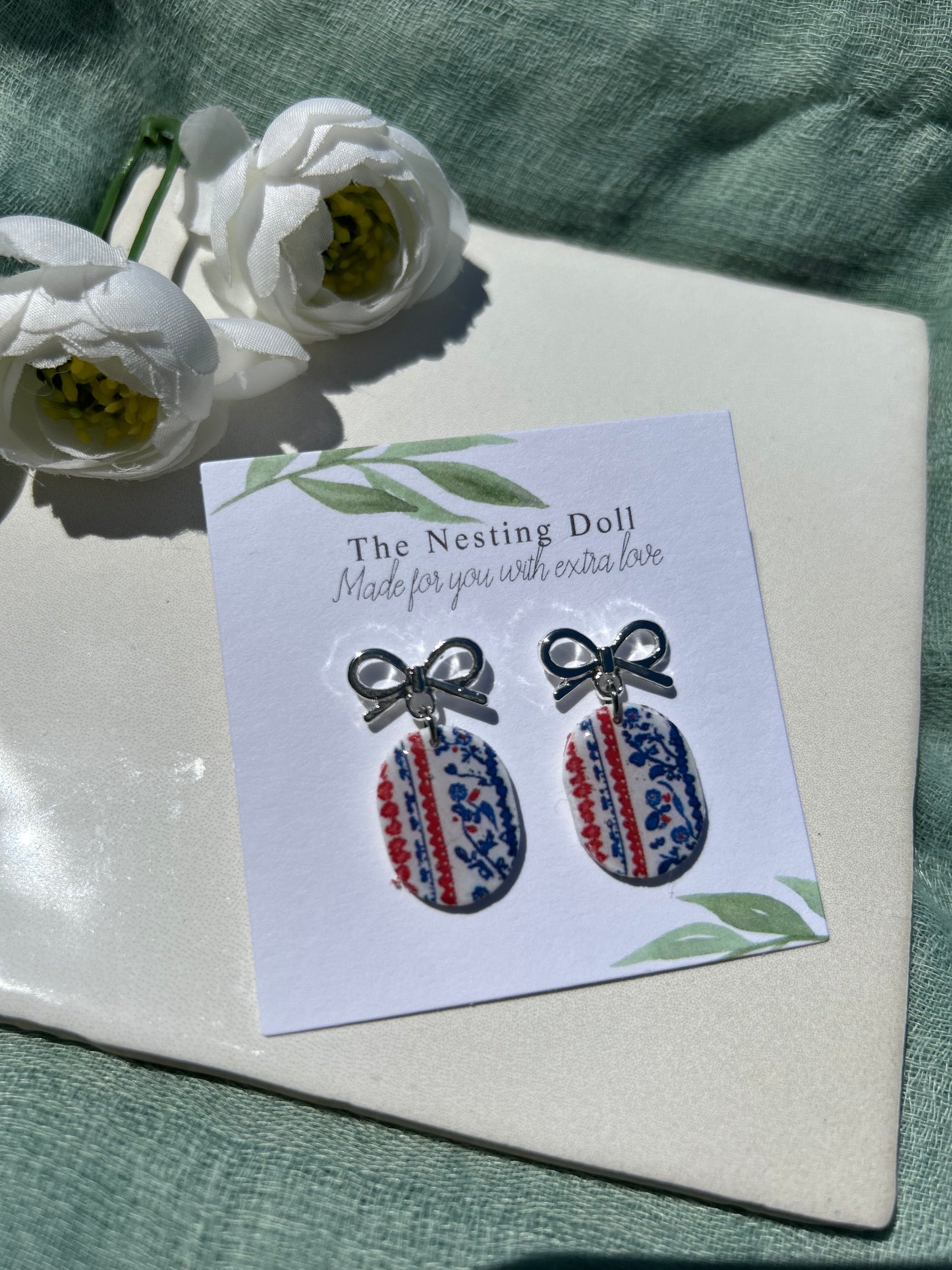 Silver Bow Oval Floral Dangles